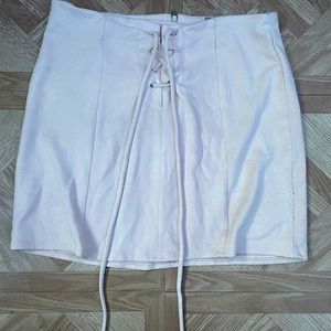 pink skirt, tiny rip on string; too big on me